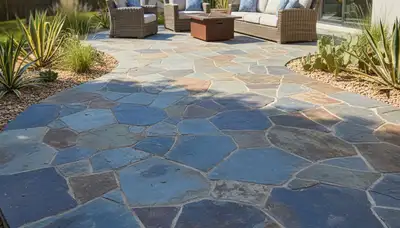 Flagstone patio with natural stone pavers installed by landscaping experts in Austin, TX